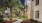 walking path framed with palm trees and buildings