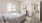 bright bedroom with a bed and a fan