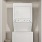 stacked washer/dryer unit in laundry
