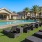 lawn of lounge chairs next to pool