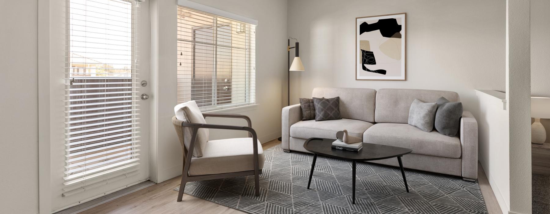 furnished living room with access to private balcony