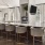 clubhouse kitchen with a bar and chairs
